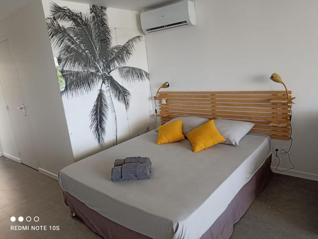 Postel nebo postele na pokoji v ubytování Nouveau Domaine de Mabouya vue mer et proximité plage