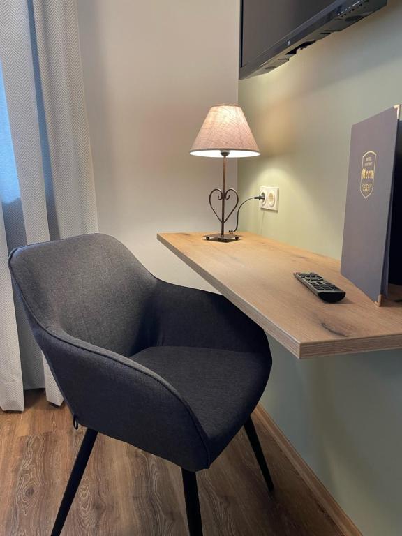 TV a/nebo společenská místnost v ubytování Hotel Garni Kern