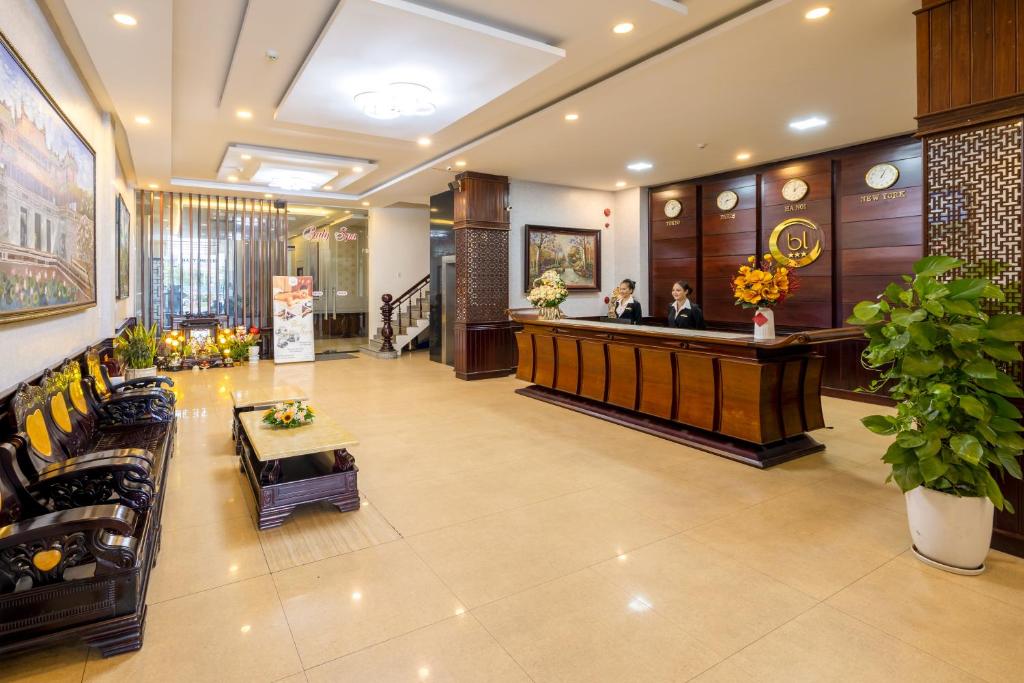 a lobby with a reception desk in a hotel at Baly Hotel And Spa in Hue