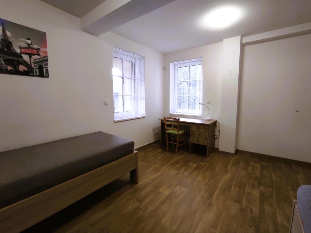 Postel nebo postele na pokoji v ubytování Apartmány Říčky