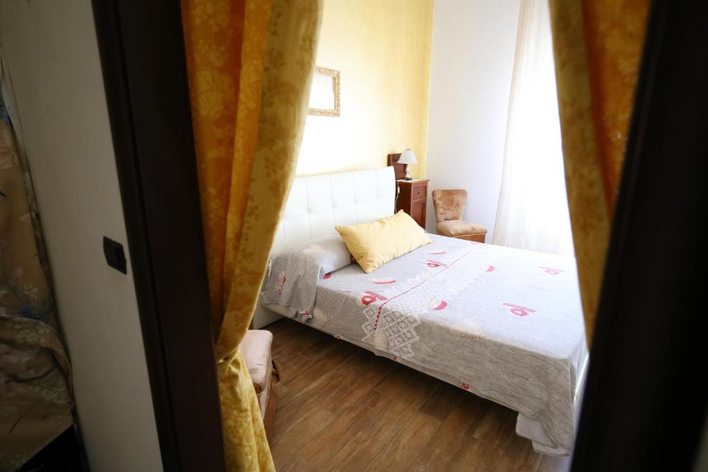 Ένα ή περισσότερα κρεβάτια σε δωμάτιο στο casa filomena