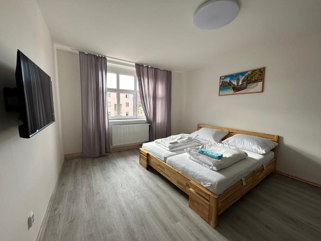 Łóżko lub łóżka w pokoju w obiekcie KK Apartments