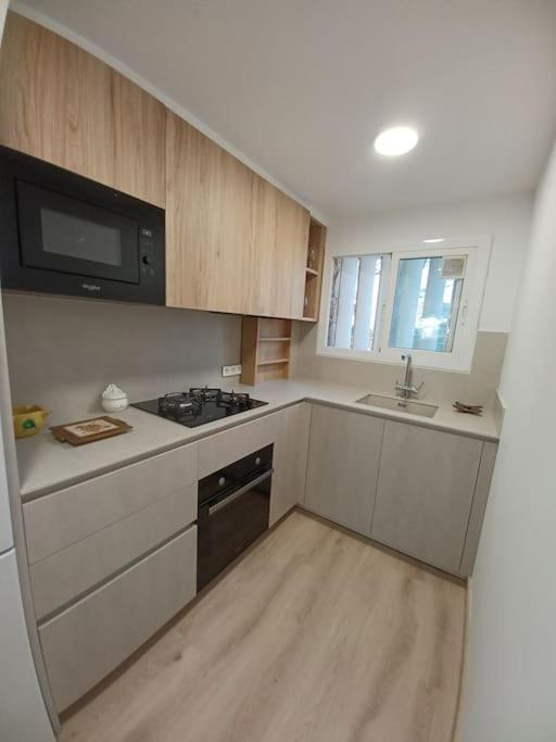 Kuchyň nebo kuchyňský kout v ubytování Apartamento Roc Mar
