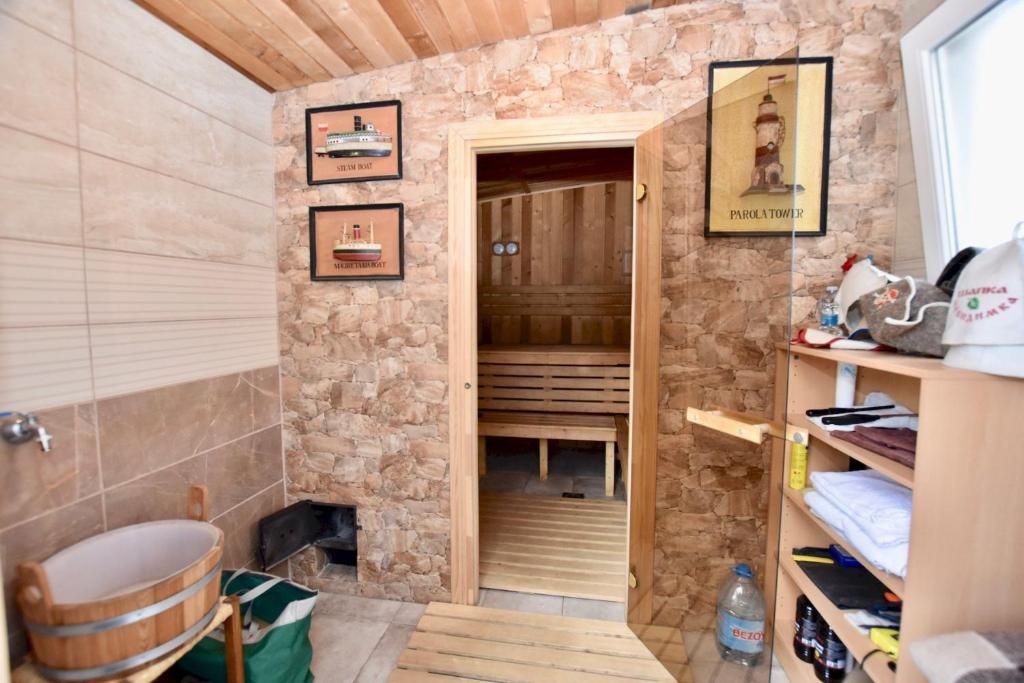 a small room with a stone wall and a door at Apartments in a "VILLA VISTA JAVEA" in Jávea