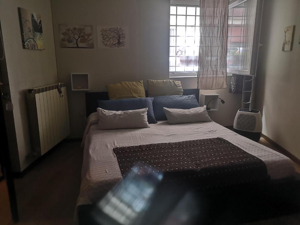 Ένα ή περισσότερα κρεβάτια σε δωμάτιο στο Angolo Nally