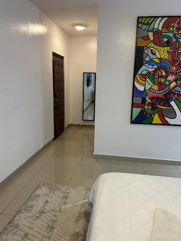 Ένα ή περισσότερα κρεβάτια σε δωμάτιο στο Guided Hospitality - Luxury Accommodations
