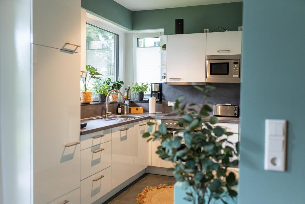Kuchyň nebo kuchyňský kout v ubytování LITELIVING Familiensuite BoHo
