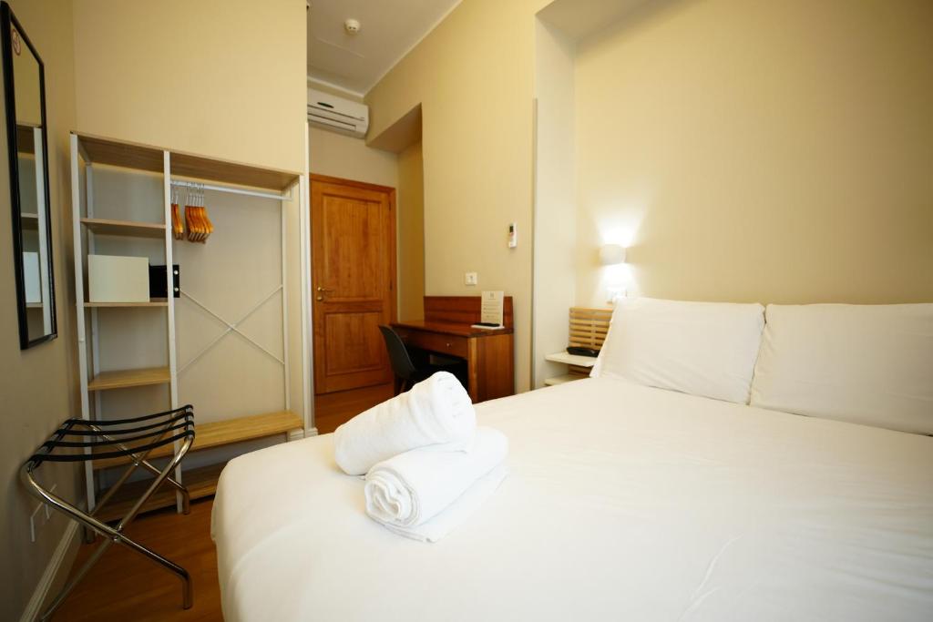 Postel nebo postele na pokoji v ubytování Hotel Montevecchio