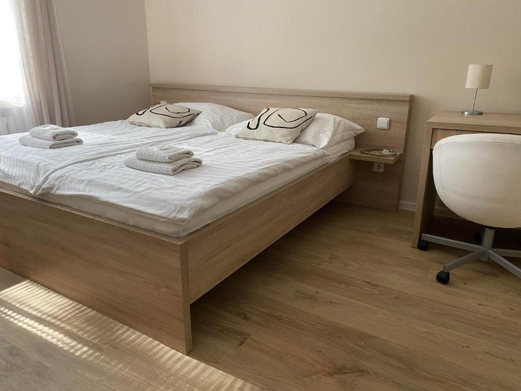 Postel nebo postele na pokoji v ubytování STING Apartments Havířov