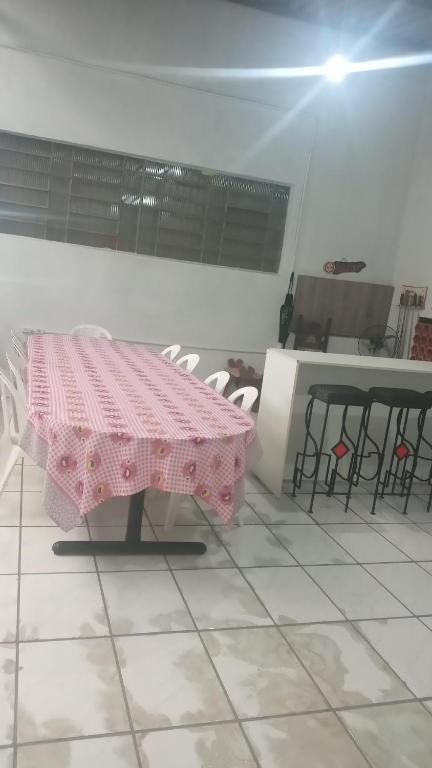 a pink table and chairs in a room at Pousada Boqueirão in Passo Fundo