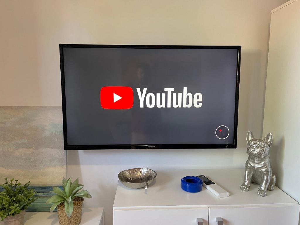 TV a/nebo společenská místnost v ubytování VILLA LUZ SUITE