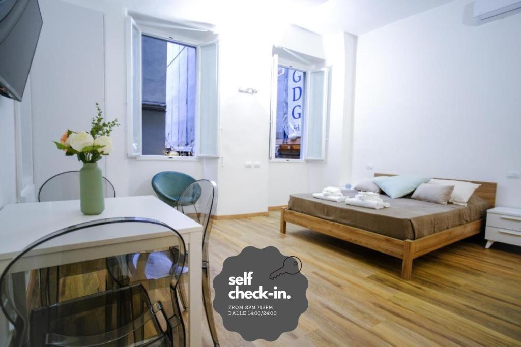 Кровать или кровати в номере Le Dantesche Boutique Apartments