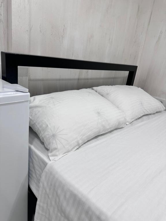 Postel nebo postele na pokoji v ubytování Mandarin Hotel