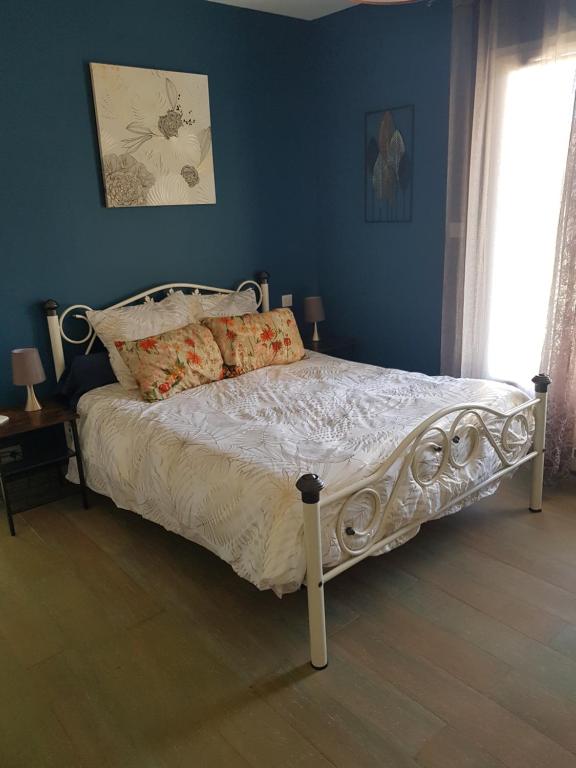 Ένα ή περισσότερα κρεβάτια σε δωμάτιο στο Appartement dans maison en RDC