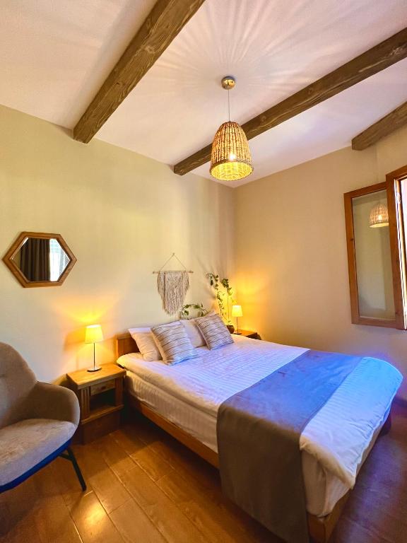 Postel nebo postele na pokoji v ubytování Hotel Borjomi Verde