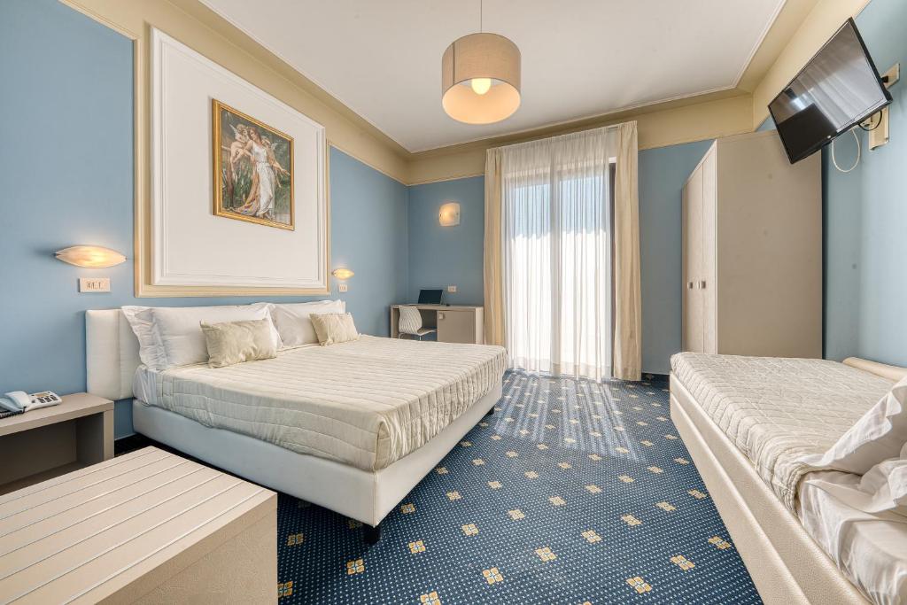 Ліжко або ліжка в номері Hotel Augustus