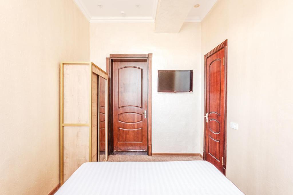 Télévision ou salle de divertissement dans l'établissement Western Suites Hotel