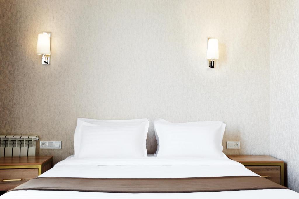 Un ou plusieurs lits dans un hébergement de l'établissement Western Suites Hotel
