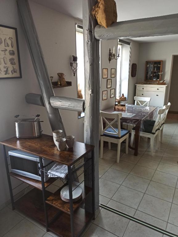 a kitchen and dining room with a table and stairs at Ferienwohnung "Frieda" in Breitenstein