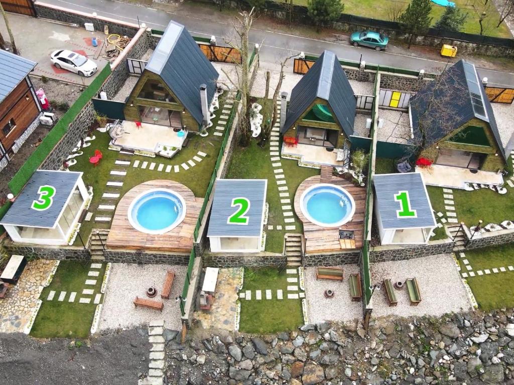 an aerial view of a house with two pool at Sapanca Sudere Bungalov 2 in Sakarya