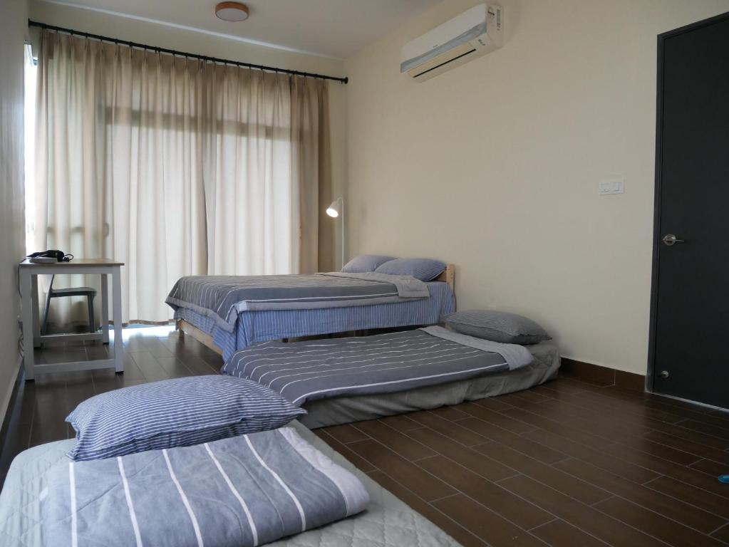 Postel nebo postele na pokoji v ubytování Jome Putrajaya Presint 8 Natural Homestay
