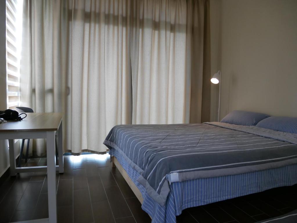 Postel nebo postele na pokoji v ubytování Jome Putrajaya Presint 8 Natural Homestay