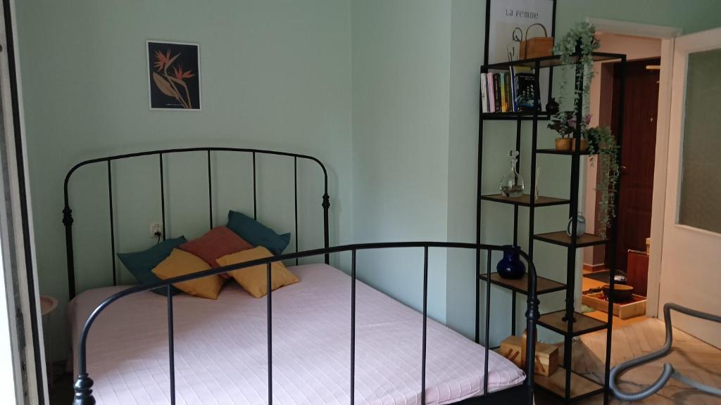 a bedroom with a bed and a book shelf at Niepodległości 859 in Sopot