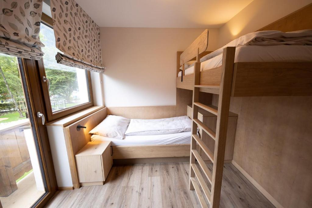 Postel nebo postele na pokoji v ubytování Das Bayrischzell Familotel Oberbayern