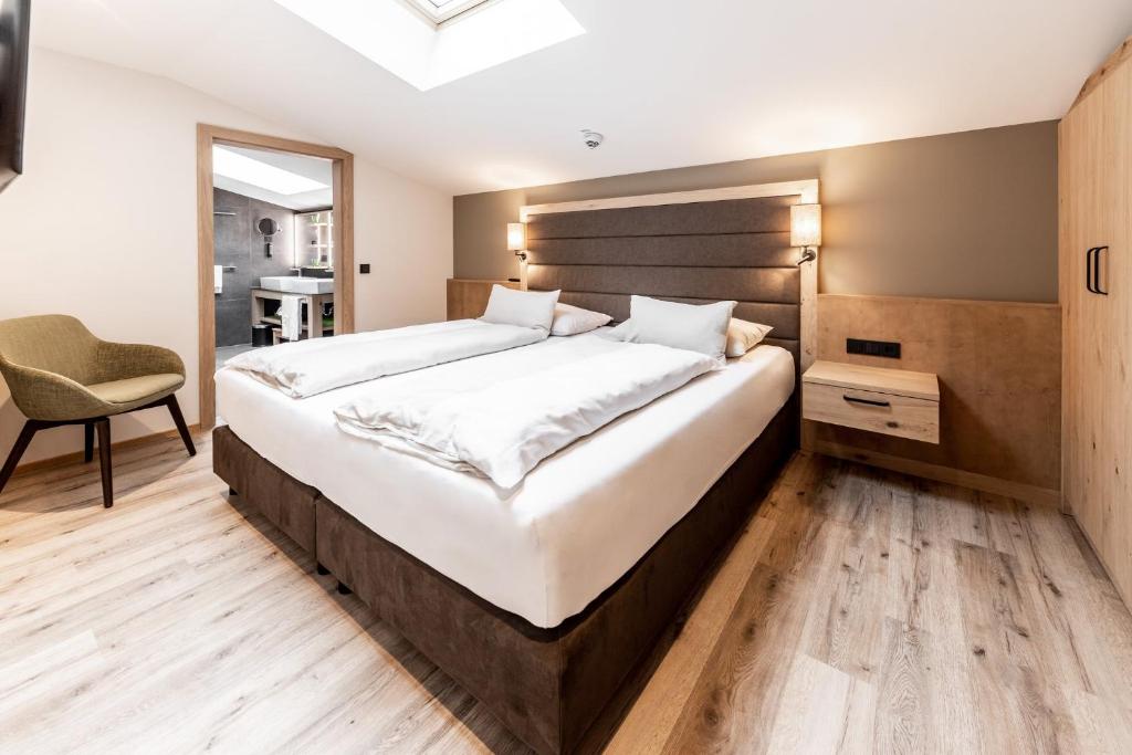 Postel nebo postele na pokoji v ubytování Das Bayrischzell Familotel Oberbayern