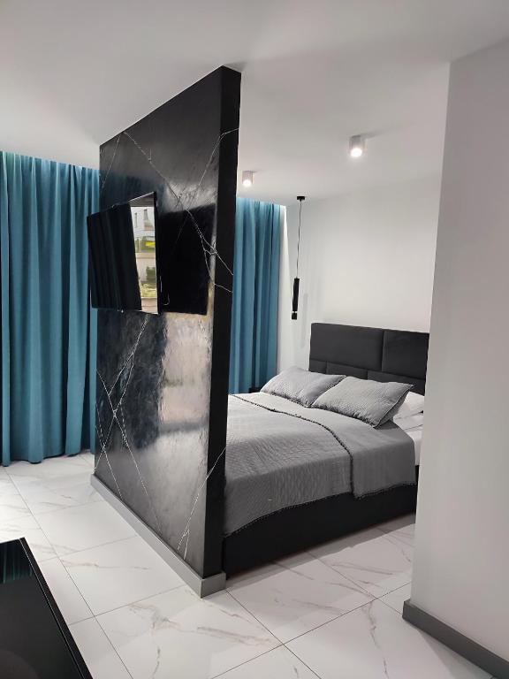 Posteľ alebo postele v izbe v ubytovaní Apartament Przystań z tarasem