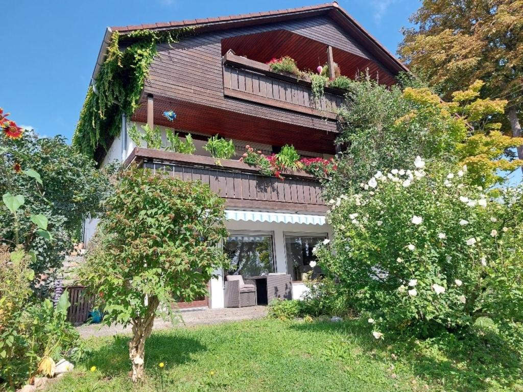 a house with plants on the side of it at Hibiskus - a83456 in Leutkirch im Allgäu