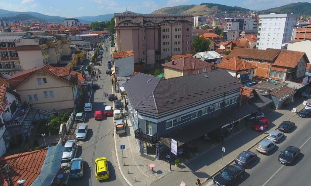 an overhead view of a city with cars parked on a street at Prenoćište-Sobe My Place in Novi Pazar