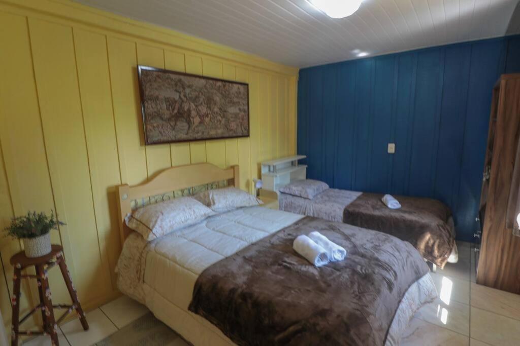 Postel nebo postele na pokoji v ubytování Chácara do Sapé