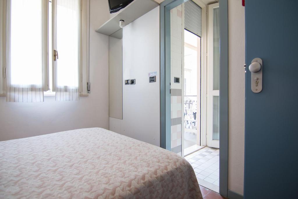 Postel nebo postele na pokoji v ubytování B&B Hotel Souvenir