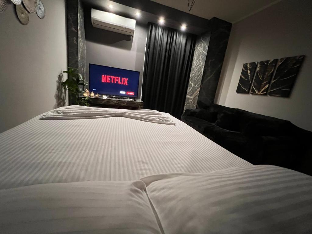 Posteľ alebo postele v izbe v ubytovaní Supreme City Heart Apartment
