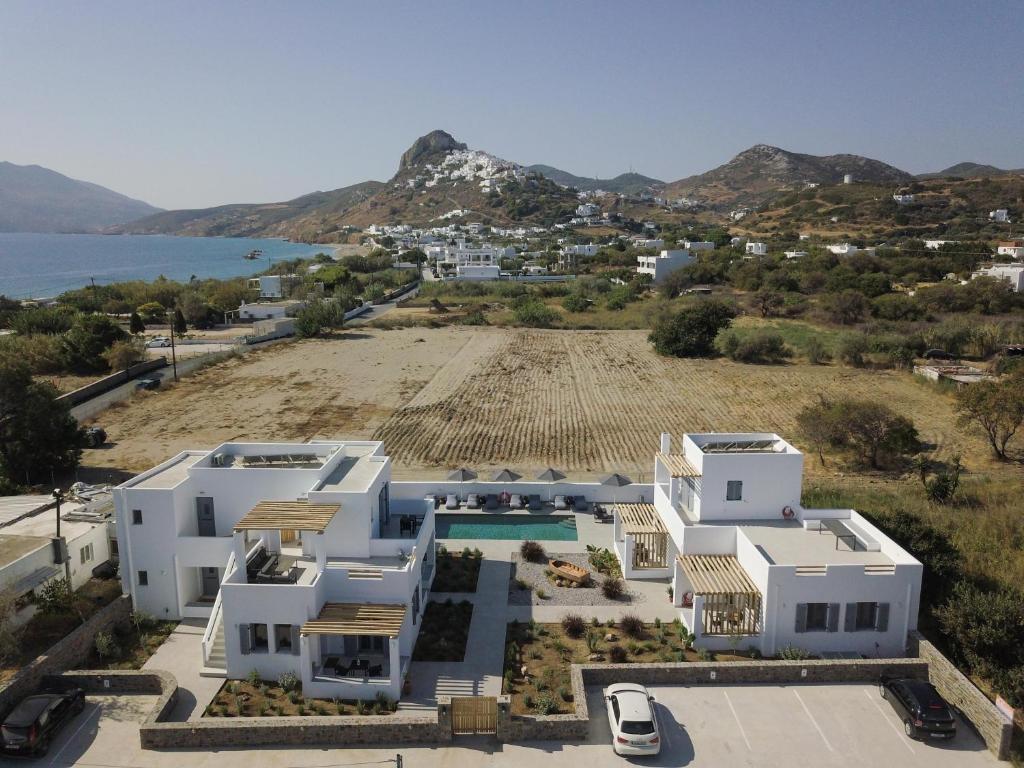 an aerial view of a villa with a beach at Kotinos Luxury Suites in Skiros