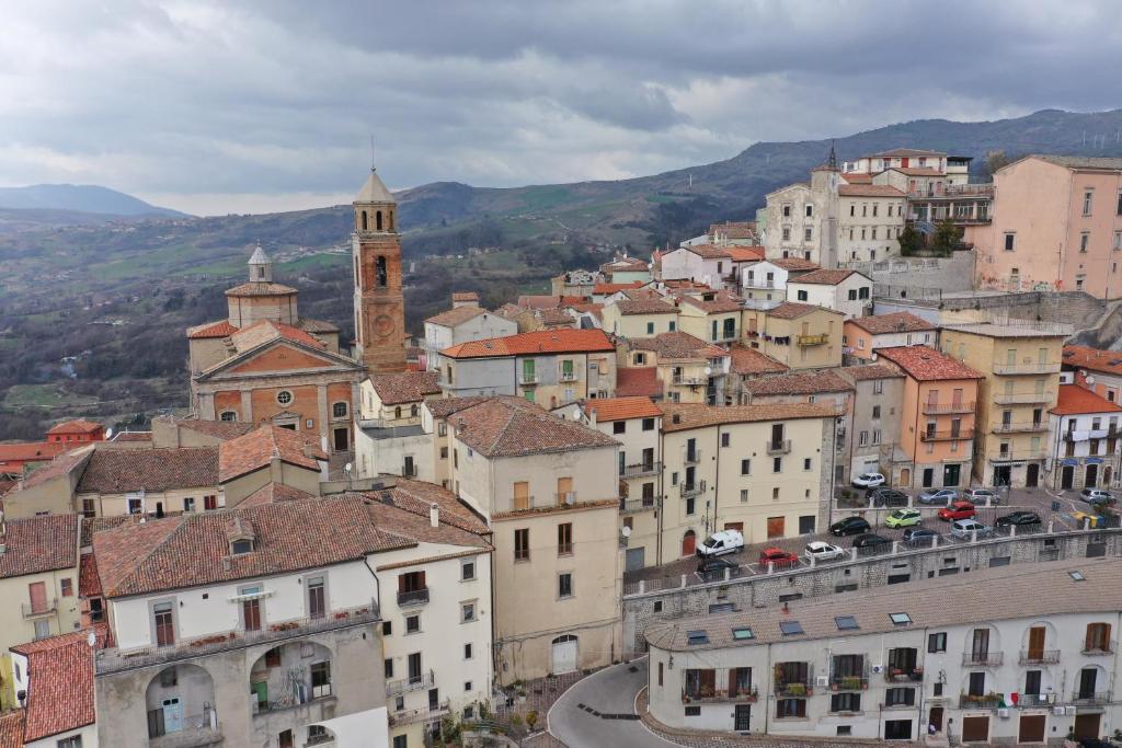 a view of a town with buildings and a clock tower at L’Arco Bed&Breakfast in Avigliano