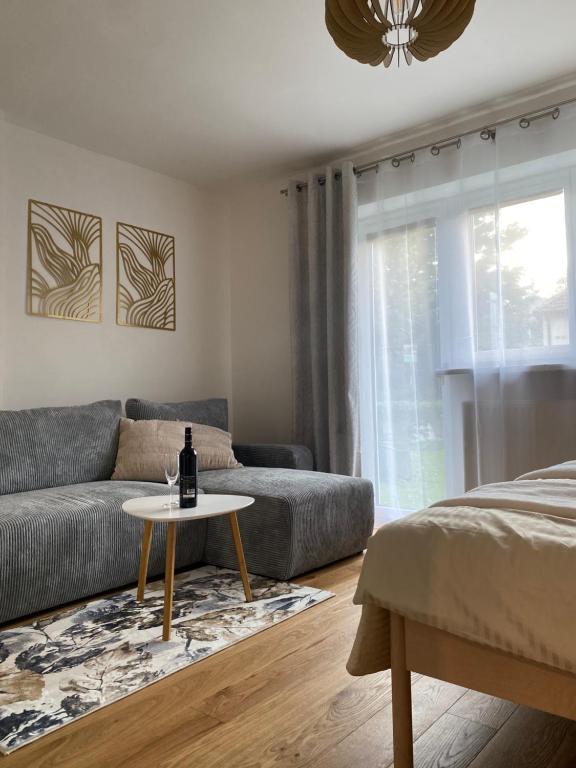 a living room with a couch and a table at Zeus apartmán in Rajecké Teplice