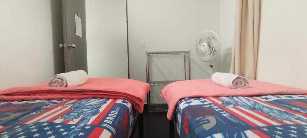 Postel nebo postele na pokoji v ubytování Hostel Metro Floresta Alojamiento