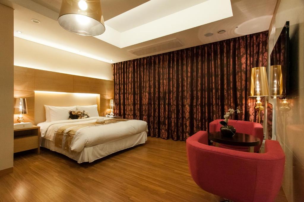 Postel nebo postele na pokoji v ubytování Hotel Pharos