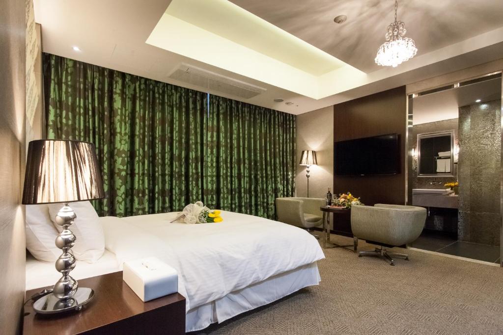Postel nebo postele na pokoji v ubytování Hotel Pharos