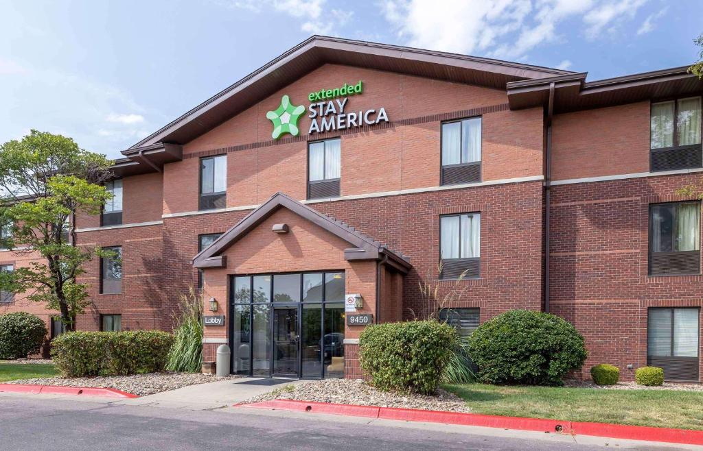 a red brick building with a sign that reads stay america at Extended Stay America Suites - Wichita - East in Wichita