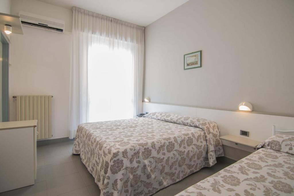 Postel nebo postele na pokoji v ubytování B&B Hotel Souvenir