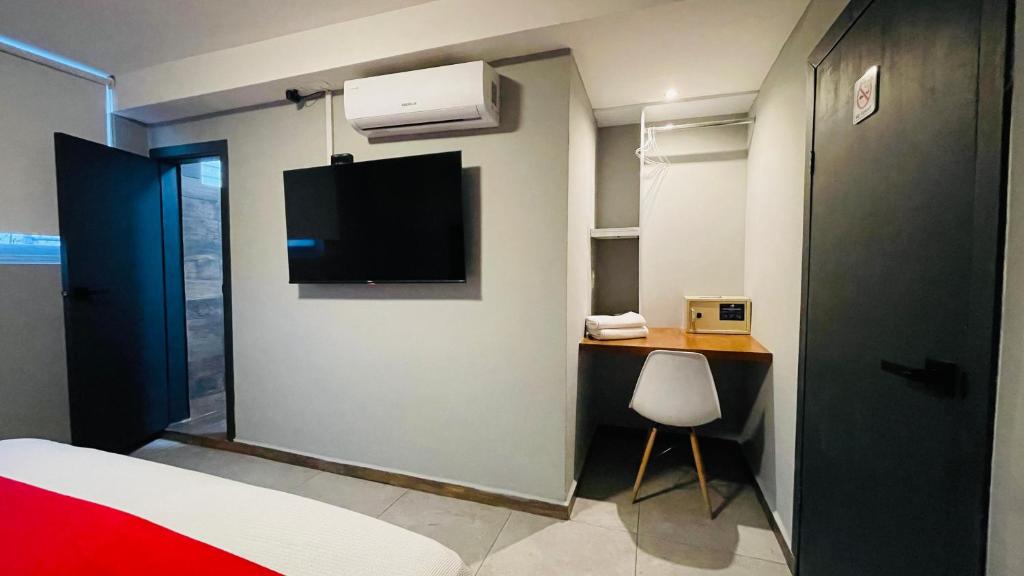 Postel nebo postele na pokoji v ubytování HIT Merida Hotel Boutique