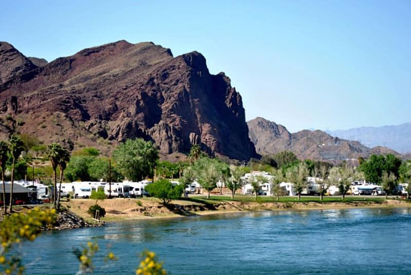 a view of a river with mountains in the background at Margaritaville at River Lodge! Right on the river! in Cross Roads