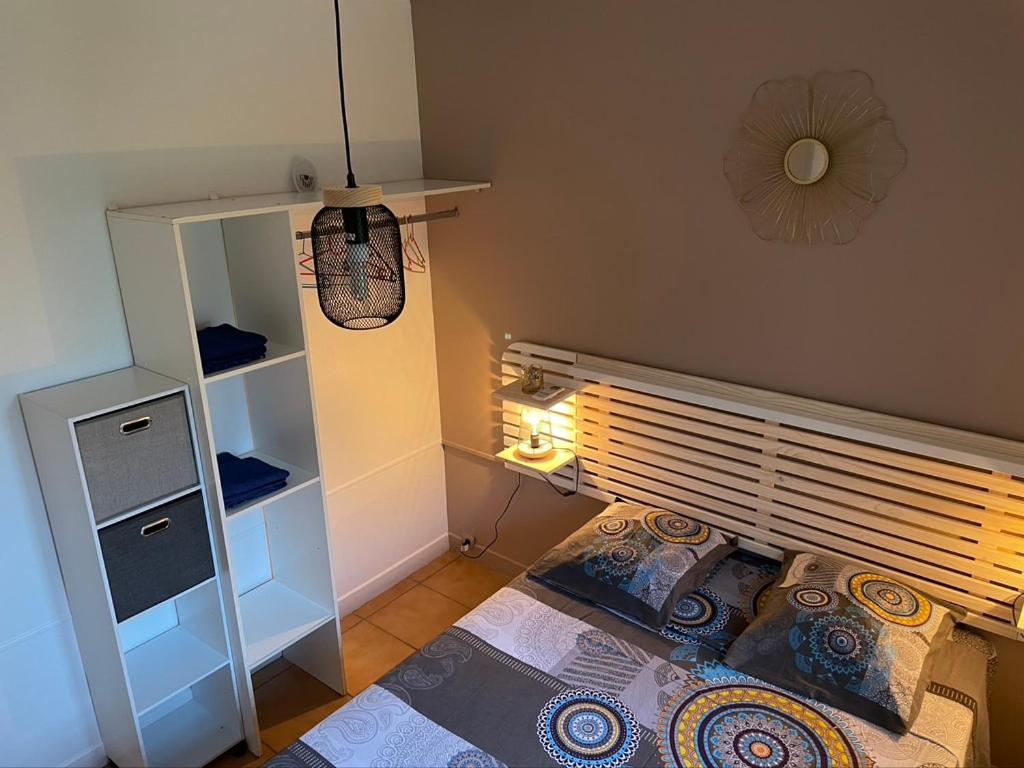 Voodi või voodid majutusasutuse Residence Les Palmiers toas
