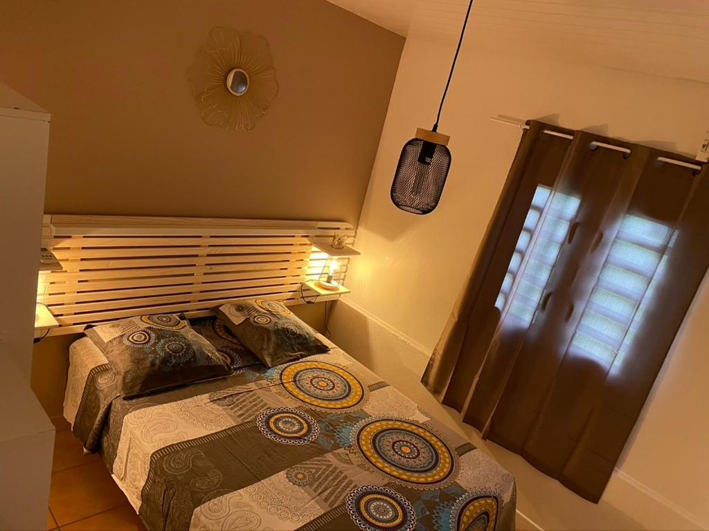 Voodi või voodid majutusasutuse Residence Les Palmiers toas