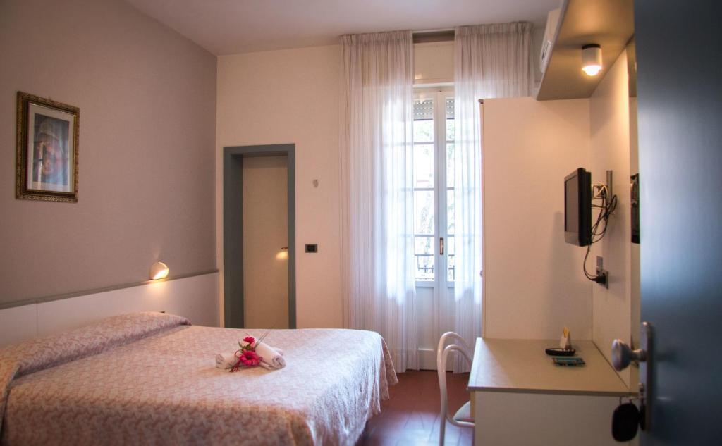 Postel nebo postele na pokoji v ubytování B&B Hotel Souvenir