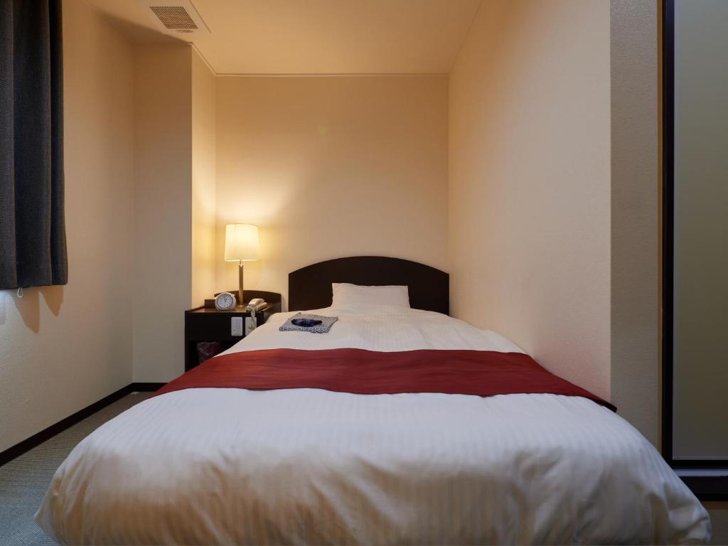 Postel nebo postele na pokoji v ubytování Hotel SIMIZU