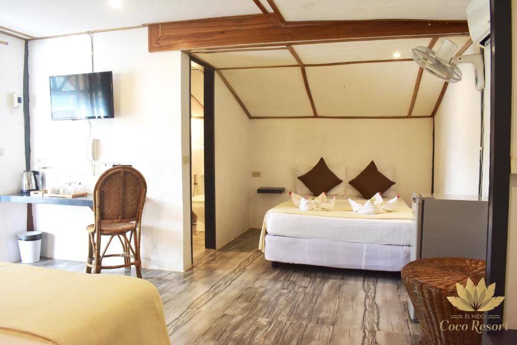 Postel nebo postele na pokoji v ubytování El Nido Coco Resort